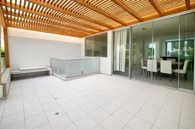an empty patio with a table and chairs at Bujama beach Home Family Asia in Mala