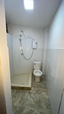 a bathroom with a toilet and a shower at Malka Casas - Hoteles in Marco