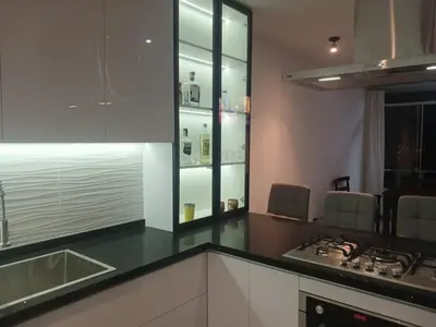 a kitchen with a stove and a counter top at Macky'sThe Silence in Bombiso