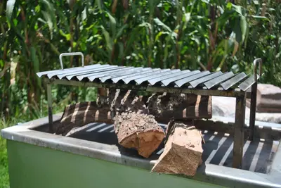 a bench sitting on top of a fire pit at Pisonaywasi - Hospedaje familiar in Urubamba