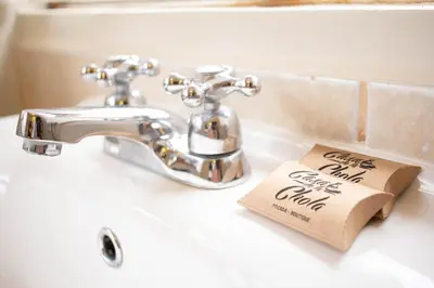 a bathroom sink with a bar of soap sitting on it at Casa de La Chola in Ollantaytambo