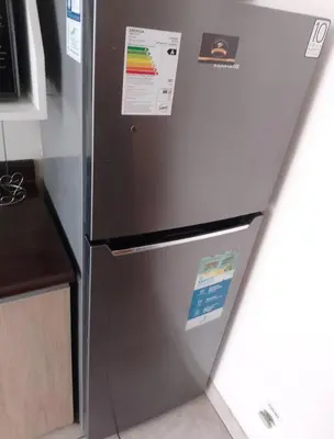 a stainless steel refrigerator in a kitchen at Alquilo Departamento en Comas in Lima