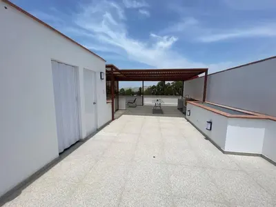 a view of the outside of a white building at Casa de campo en condo cerca a playa Puerto Viejo in San Antonio