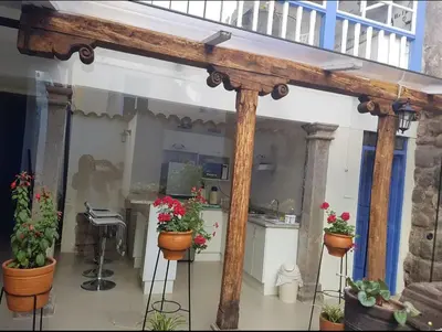 a porch with potted plants in a room at Casa Centro Historico Cusco in Cusco