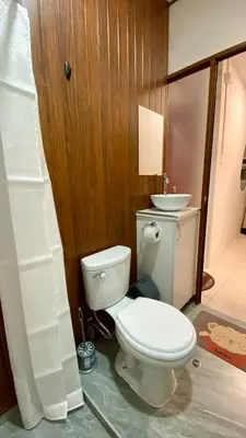 a bathroom with a toilet and a sink at Templo de la Luna Pardo in Cusco
