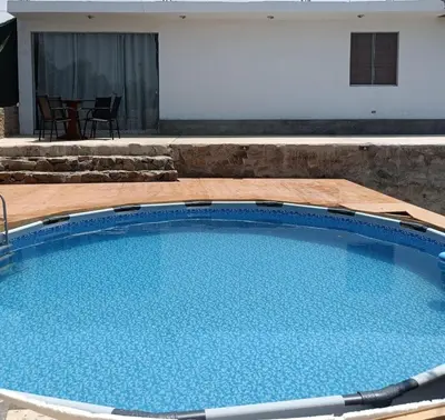 a large swimming pool with blue water at Casa EN ASIA in Asia