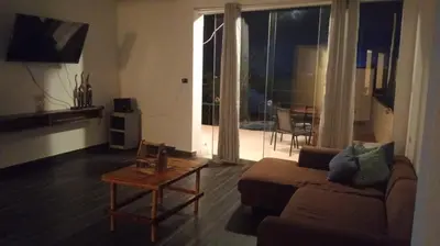 a living room with a couch and a table at Casa EN ASIA in Asia