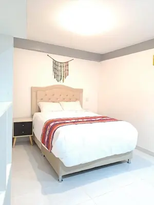 a bedroom with a bed in a room at Samin House in Cusco