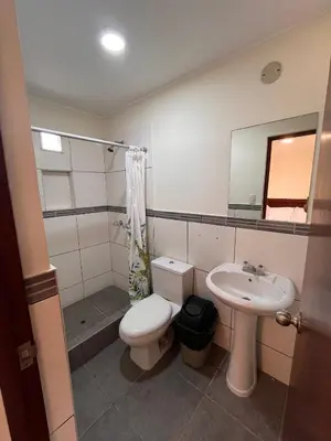 a bathroom with a toilet and a sink at Boulevard Hotel in Asia