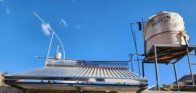 a water tower with a tank on top of it at Sol de América in La Unión