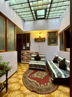 a living room with a couch and a rug at Tika house in Cusco