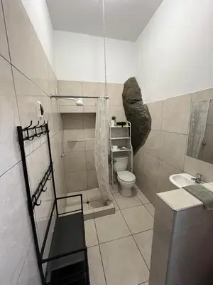 a bathroom with a toilet and a sink at Albano apartamento 3 en tu refugio Chosica in Chosica