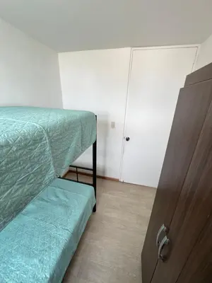 a bedroom with a bunk bed and a door at Departamento Prescott in Lima