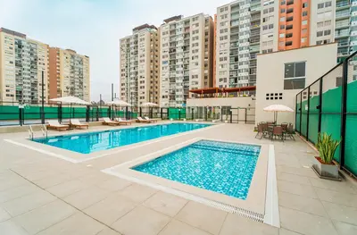 a swimming pool on the roof of a building at Depa con piscina 2025 in Lima