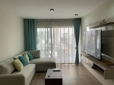 a living room with a couch and a flat screen tv at Full Depa en Miraflores in Lima