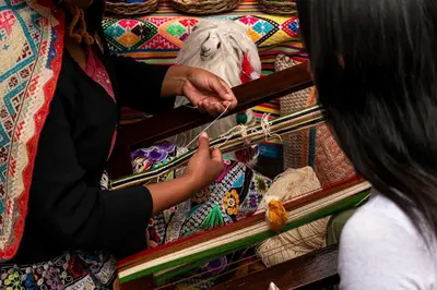 a woman is playing with a piece of thread at Union Hotel Cusco in Cusco