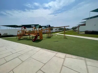 a park with a playground on a grass field at Casa de Playa Hawi in San Antonio