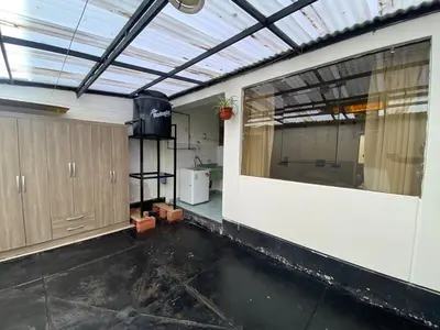 an empty room with a large window in a building at Family-friendly apartment! in Cusco