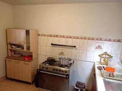 a kitchen with a stove and a counter top at Casa Halcones Huachipa Familia & Eventos in Lima