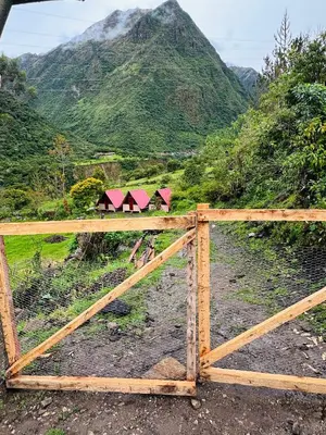 a wooden fence with a view of a mountain at Salkantay Glamp in Colcapampa