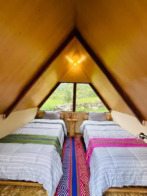 a room with three beds in a roof at Salkantay Glamp in Colcapampa