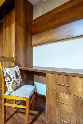 a wooden desk with a chair in a room at Classy Andino & primer piso, 2 dormitorios in Lima