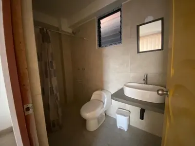a bathroom with a toilet and a sink at Casa Moriáh in Maras
