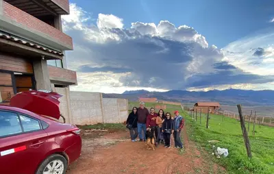 a group of people posing for a picture with their dog at Casa Moriáh in Maras