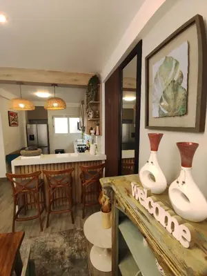 a kitchen and living room with a table with vases on it at Casa de playa Bujama, Mala, Asia, Lima, Moravia II in Bujama Baja