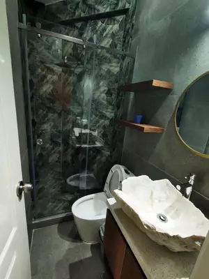 a bathroom with a shower and a toilet and a sink at Casa de playa Bujama, Mala, Asia, Lima, Moravia II in Bujama Baja