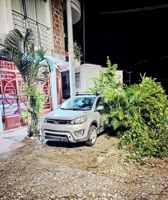 a silver car parked in front of a building at PIERO HOUSE - La Merced in La Merced