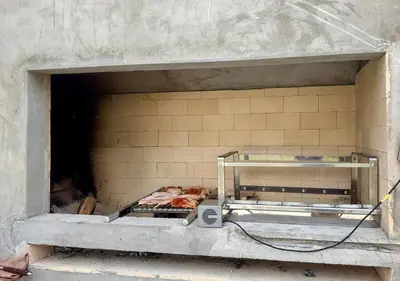 a brick oven with some food inside of it at Casa Chocaya Playa Campo in Fundo Copacabana