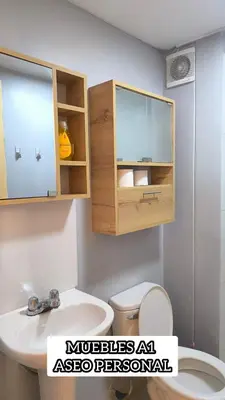 a bathroom with a sink and a toilet and a cabinet at apartment Campoy for tourist in Lima