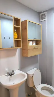 a bathroom with a toilet and a sink at apartment Campoy for tourist in Lima