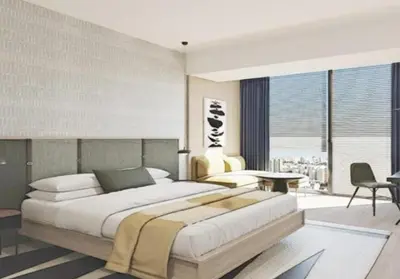 a bedroom with a large bed and a large window at Hotel Indigo Lima Miraflores by IHG in Lima