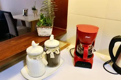 a red and white blender sitting on a counter at GRM302 Apt Moderno 2 DRM with KING Bed in Miraflores in Lima