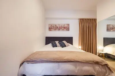 a bedroom with a large bed with two pillows on it at GRM302 Apt Moderno 2 DRM with KING Bed in Miraflores in Lima