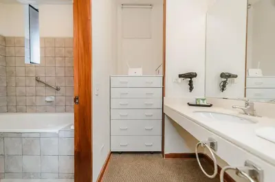 a bathroom with a sink and a shower and a tub at Alcanfores - Tu Escapada Urbana Perfecta in Lima