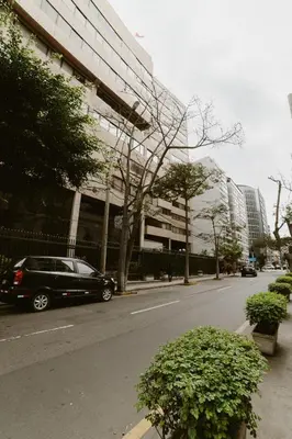 a car parked on a street in front of a building at GRM1601 Modern 1 BDR with skyline views from Miraflores in Lima