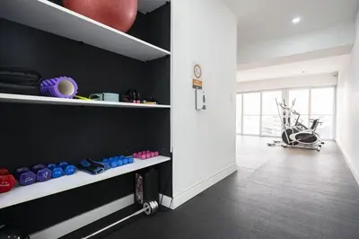 a room with black walls and white shelves at Balta - Apartment with Panoramic View in Kennedy Park in Lima