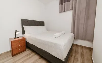 a bedroom with a bed with two towels on it at GRM308 Bright 2BR with BIG Terrace in Heart of Miraflores in Lima