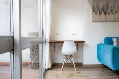a living room with a desk and a chair at GRM308 Bright 2BR with BIG Terrace in Heart of Miraflores in Lima