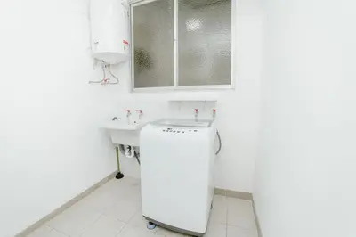 a white bathroom with a sink and a dishwasher at GRM308 Bright 2BR with BIG Terrace in Heart of Miraflores in Lima