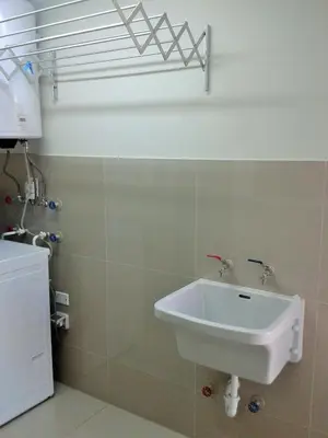a bathroom with a white sink in a room at Peru Rent Apart com pe in Lima