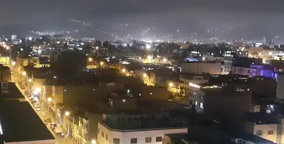 a view of a city at night with lights at 10p dpto in Lima