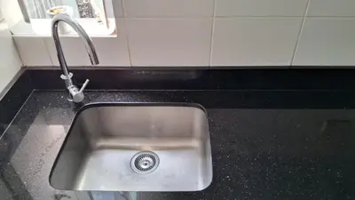 a kitchen sink with a faucet on a counter at El Derby 511 Aparts de 3 Dorm con Aire Acondicionado in Lima