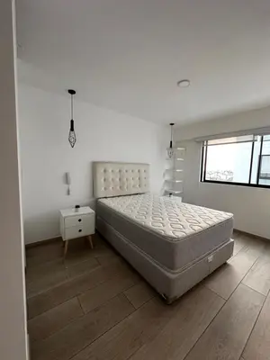 a bedroom with a large bed and a wooden floor at molero in Lima