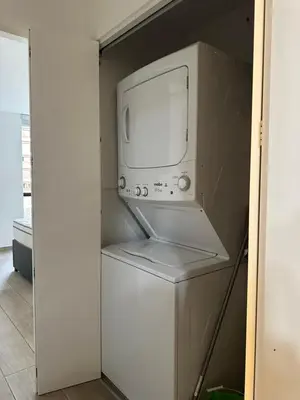 a microwave sitting on top of a refrigerator at molero in Lima