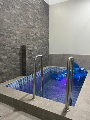 a swimming pool with a blue at Huacachina Lagoon House in Ica