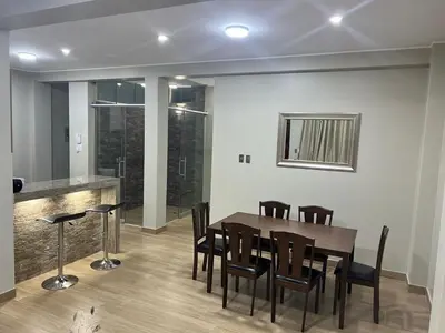 a dining room with a table and chairs at Huacachina Lagoon House in Ica
